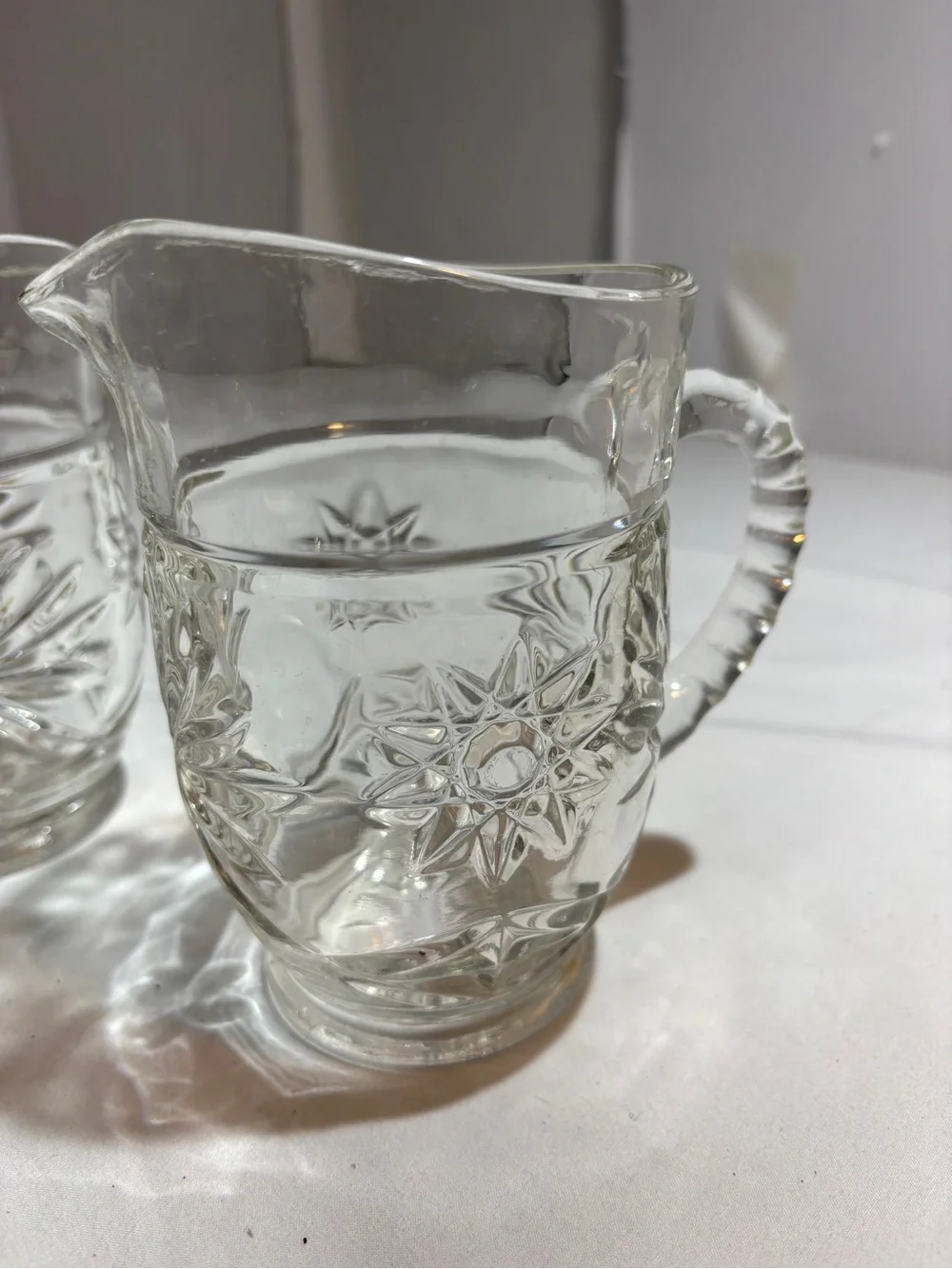 Clear Patterned Glass small pitchers  - Set of 2